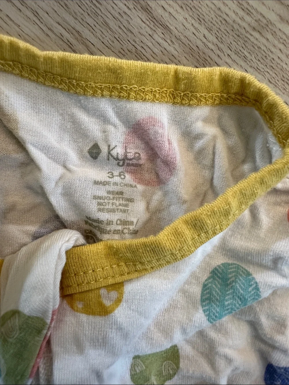 Kyte BABY White Footed Pajamas with Multicolor Dot Print and Yellow Trim